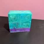 Square soap bar with a mix of Green, Blue (swirled together) and Purple.