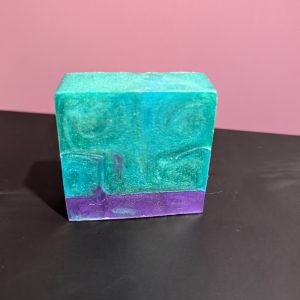Square soap bar with a mix of Green, Blue (swirled together) and Purple.